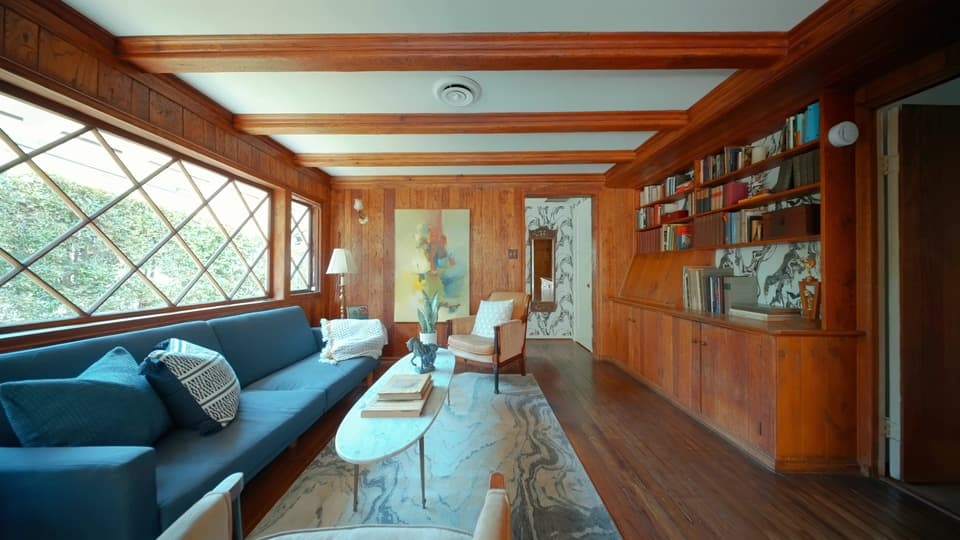 Wood-paneled living room and library from the Beverly Glen listing film