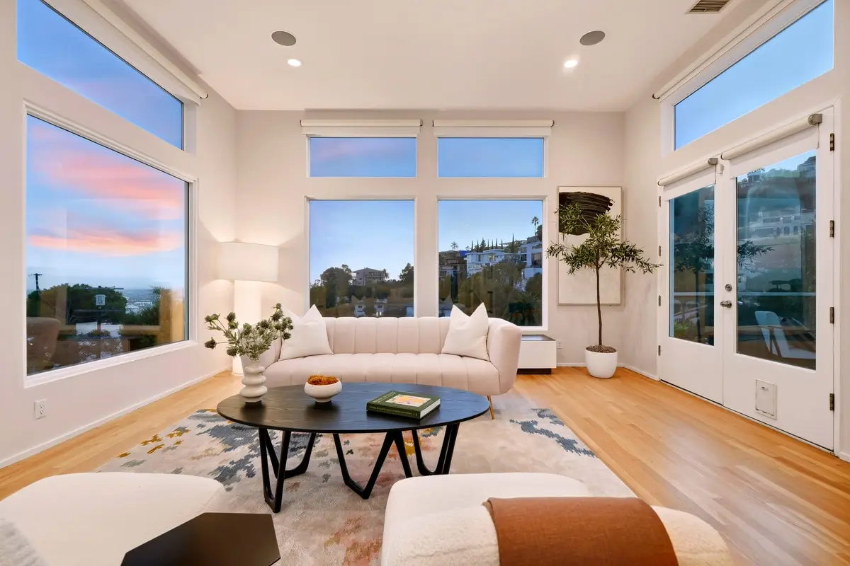 Hollywood Hills living room with city view at twilight
